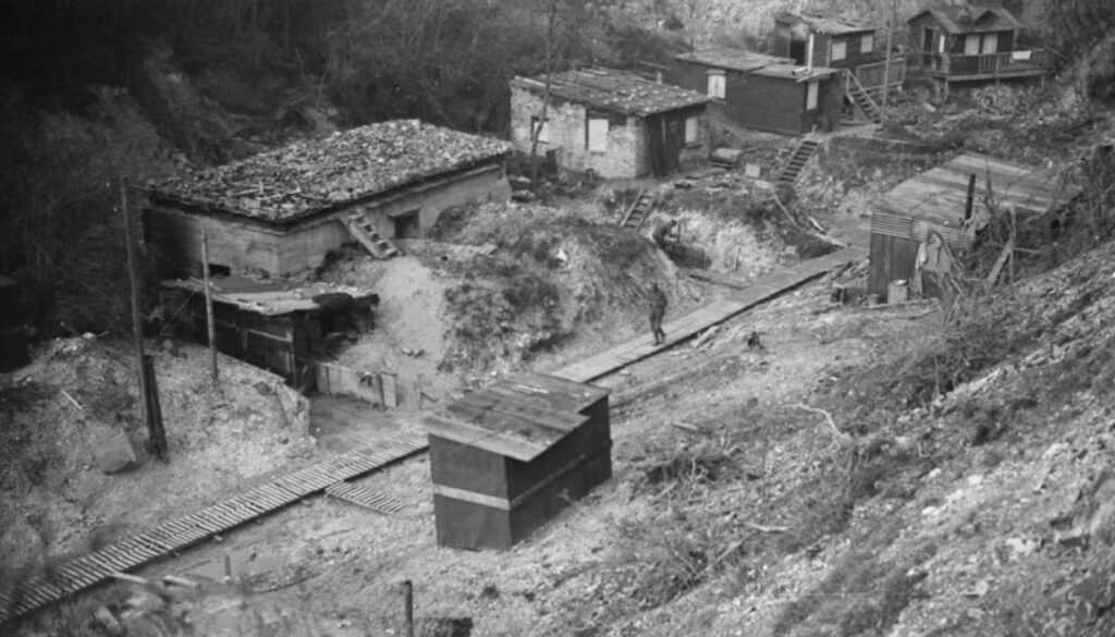 284_A scene in a quarry showing concrete dug-out and chalets left behind by the enemy. November, 1918.
